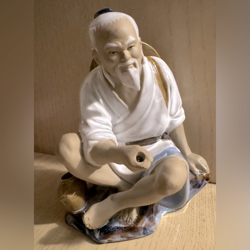 Chinese mudman fisherman.
